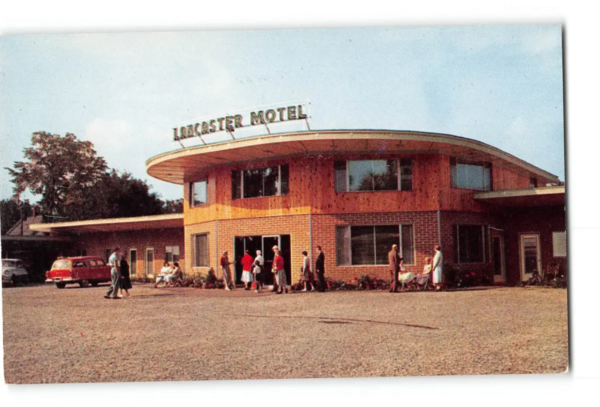 Vintage postcard of The Lancaster Motel — close-up of the property and signage in mid-century motor lodge style