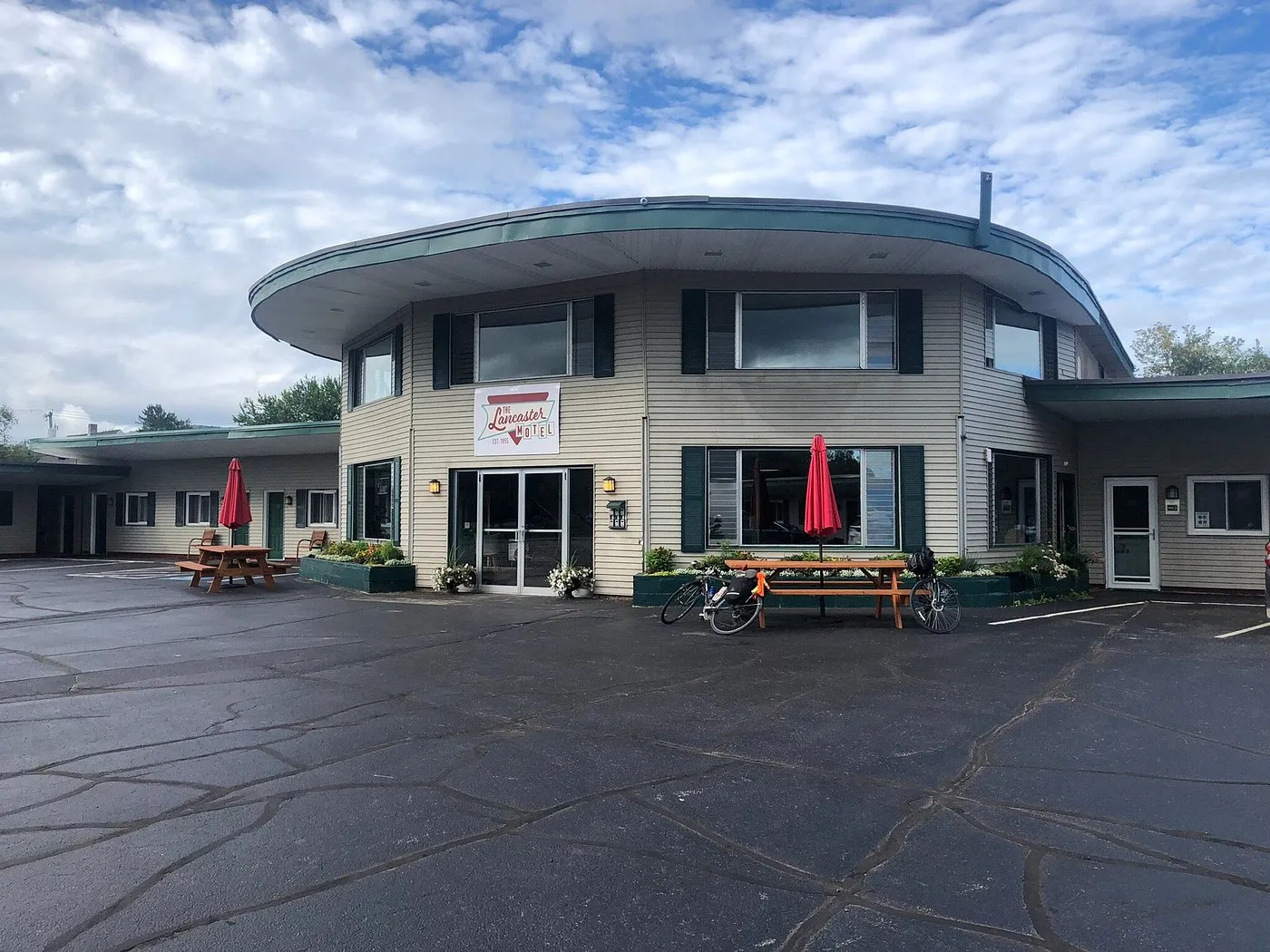 The same curved-roof 1955 building today — exterior of the property in downtown Lancaster, New Hampshire