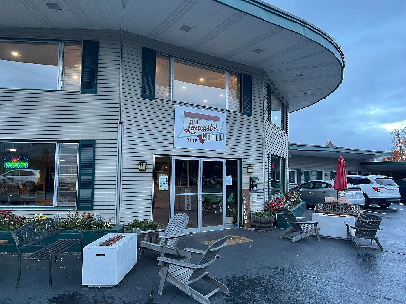 Red Fox Inn exterior — the curved-roof 1955 motor lodge in downtown Lancaster, NH