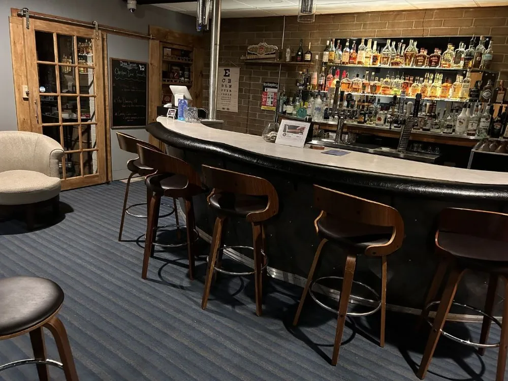 The Den cocktail bar at Red Fox Inn — bar counter and lounge seating