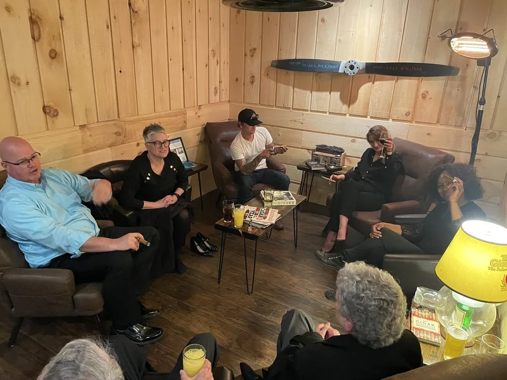 The Dusk cigar lounge at Red Fox Inn — leather chairs in warm light